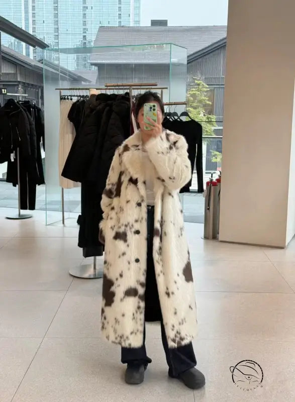 Cozy faux fur long coat in black and white cow print spots
