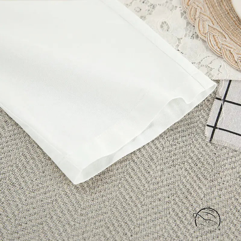 Crisp white cotton langry nightgown with lace up design and folded edge