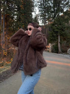Elegant Langry faux fur fox coat in brown black with hood and oversized sleeves