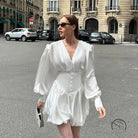 Elegant white satin mini dress with V-neck and lantern sleeves in fashion style