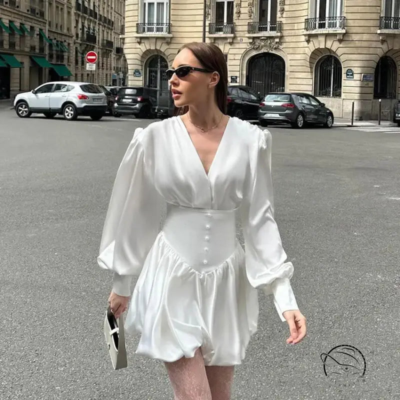 Elegant white satin mini dress with V-neck and lantern sleeves in fashion style