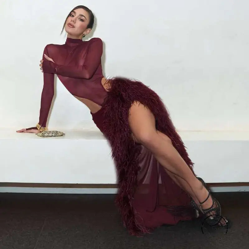 Slim fit mesh turtleneck jumpsuit with burgundy feathered split skirt
