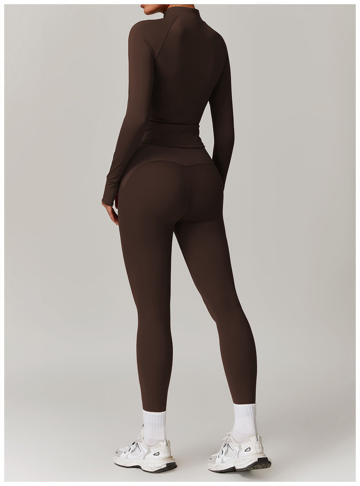 Brown long-sleeved athletic jumpsuit with white socks and chunky sneakers for Langry fashion