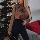 Light brown satin floral decoration shirt with ruffled floral appliques and black trousers