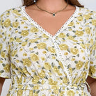 Boho lace floral dress in white with yellow pattern and lace trim