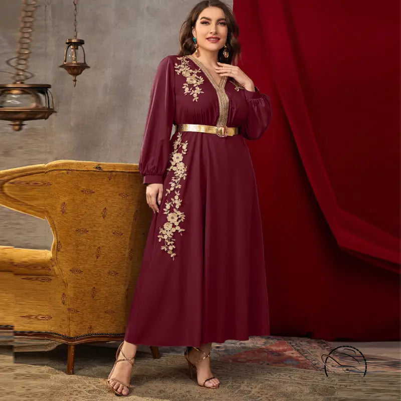 Maroon long-sleeved A-line dress with gold floral embroidery and metallic belt