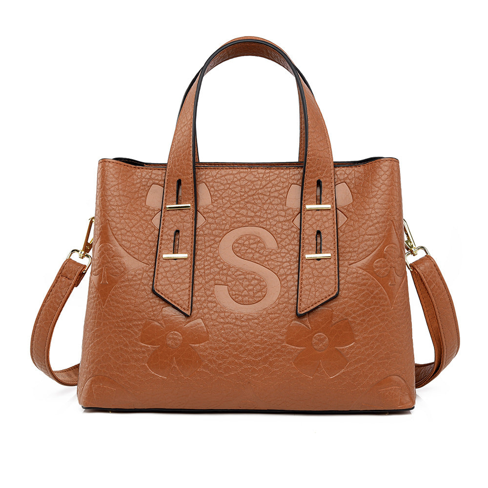 Langry fashion brown leather tote bag with floral embossing