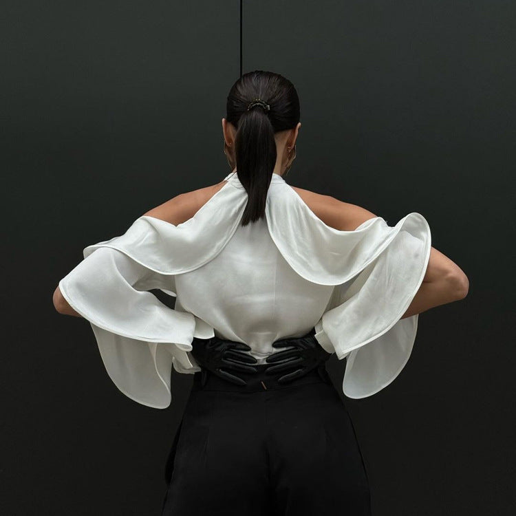 Elegant French Design Halter Top with white ruffled blouse and flowing sleeves over black pants