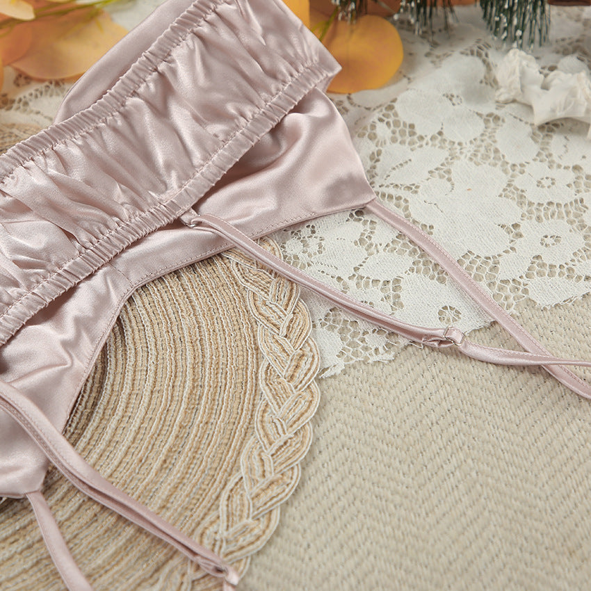 Light pink satin women’s lingerie top with spaghetti straps from Winter Skin-Friendly Pajamas Set, perfect for fashionable loungewear
