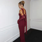 Elegant burgundy langry fashion gown with matching gloves for winter evenings