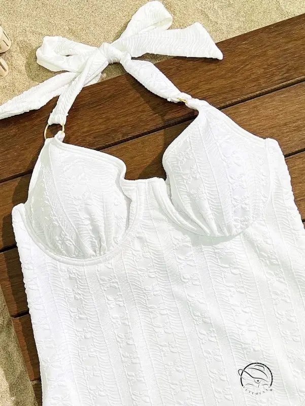 Elegant white embroidered swimsuit with lace halter top and bow strap