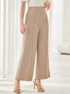 High-waisted beige wide leg trousers featuring a flowing silhouette for elegant fashion