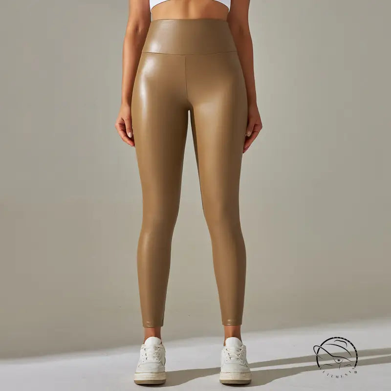 Shiny high-waist faux leather leggings in gold finish