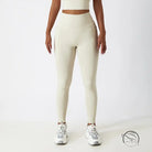 Cream-colored high-waisted yoga pants with white sneakers for langry fashion