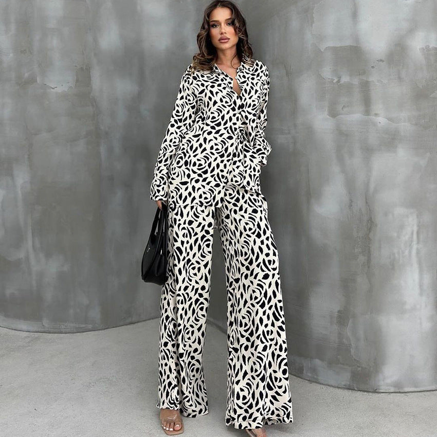 Woman wearing loose leopard print pajamas set with black and white patterned shirt and wide-leg pants