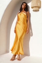Langry mustard yellow satin dress with one-shoulder halterneck and flared skirt
