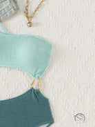 Stunning hollow out bikini in mint teal knit with gold hardware