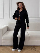 Langry fashion black zip-up tracksuit with wide-leg pants and white sneakers