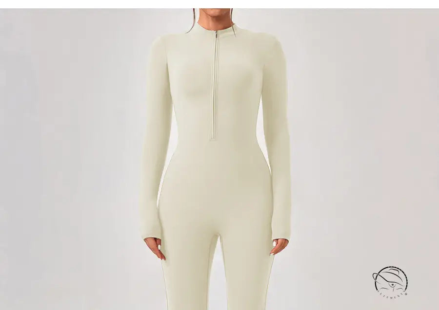 Cream-colored long-sleeve one piece sportswear with front zipper neckline