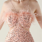 Elegant rose gold sequined Langry fashion evening dress with ostrich feather accents and sweetheart neckline