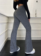 Gray flared yoga pants featuring stretchy ribbed texture for stylish casual women’s fashion