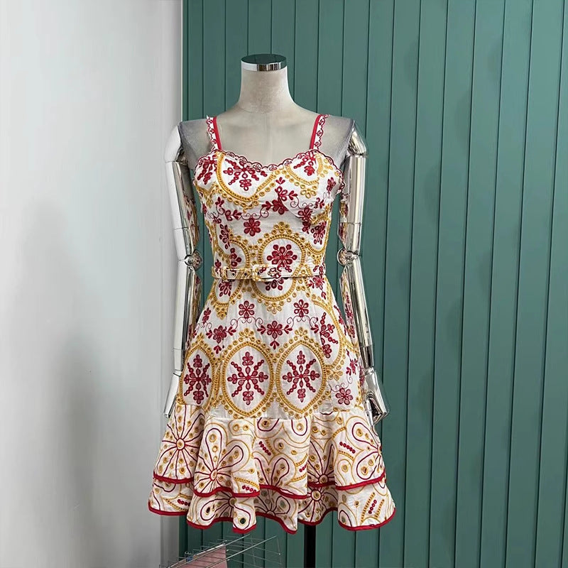 Floral sundress on mannequin showcasing vibrant red and yellow pattern for summer fashion