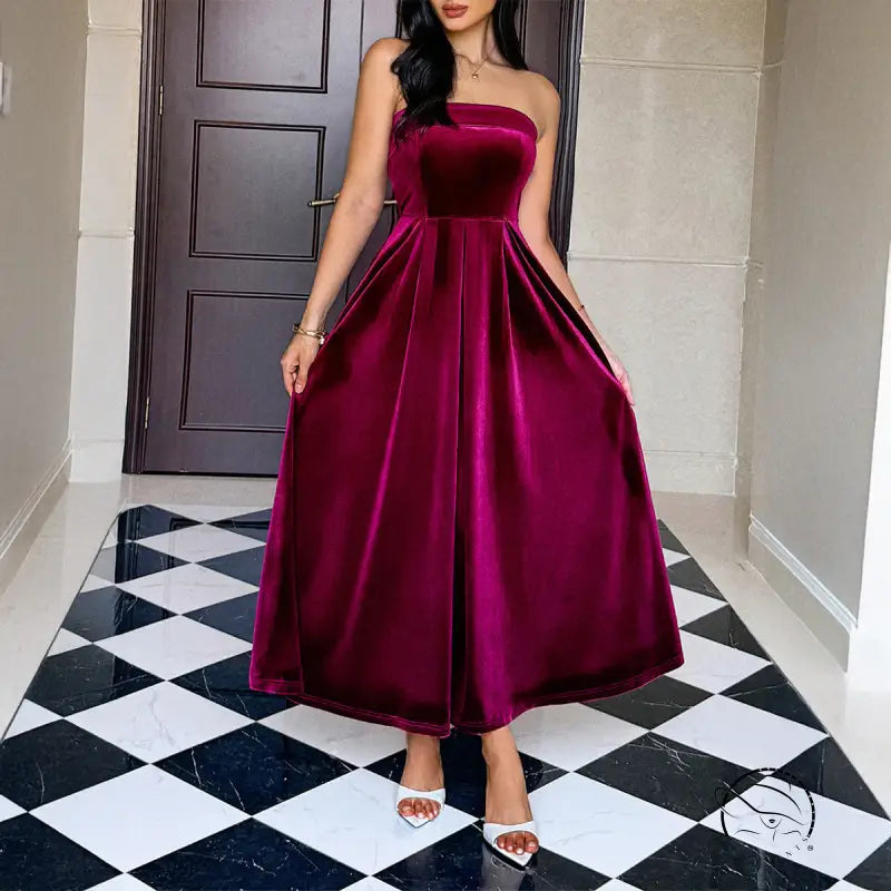 Elegant graceful tube top maxi dress in burgundy velvet with high-low hemline