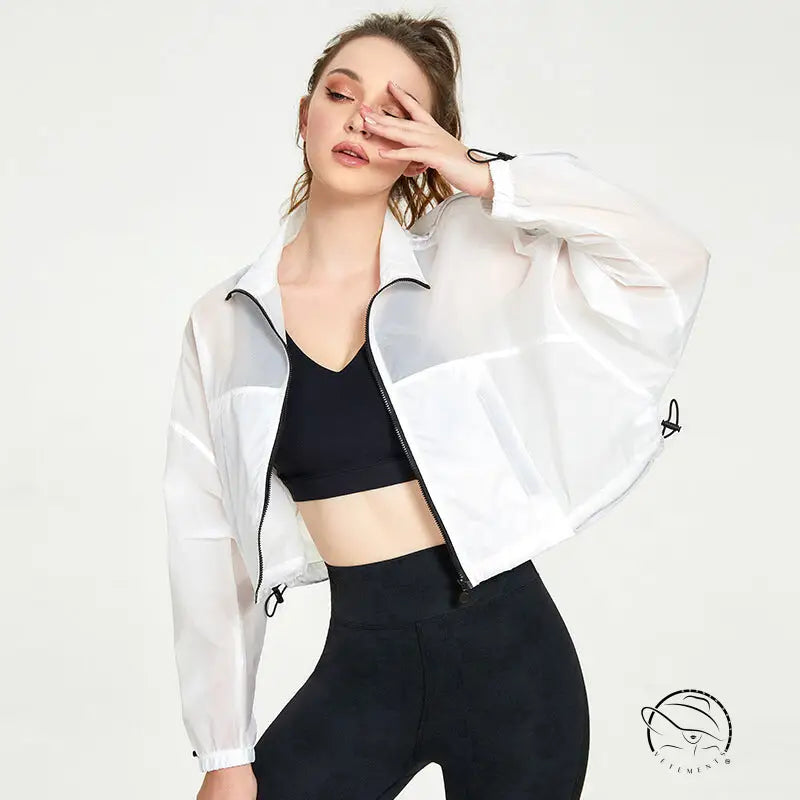 Woman in white translucent cropped casual loose cardigan for yoga