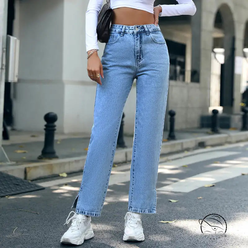 Trendy denim trousers in light-wash straight-leg style with ankle slits