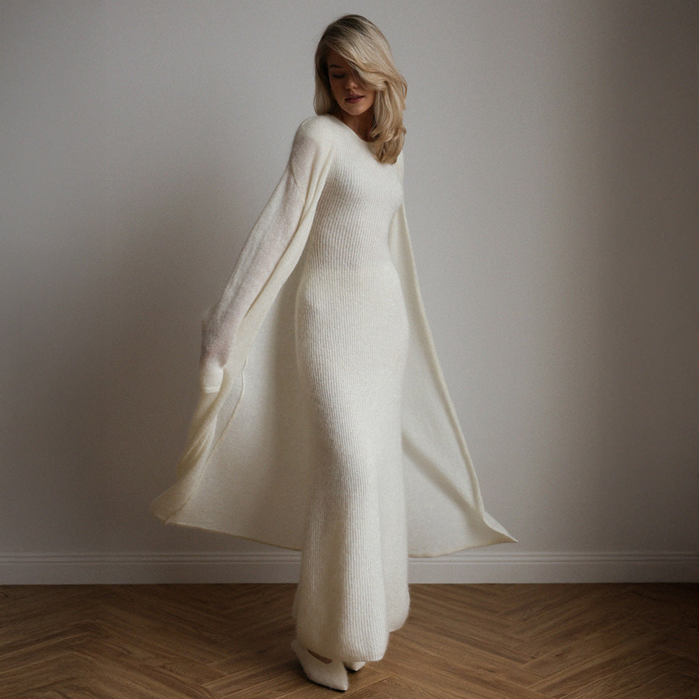 Cream-colored knitted cardigan sleeveless dress with long sleeves and flowing skirt