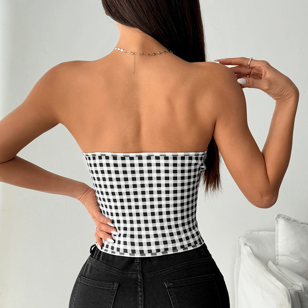 Langry fashion black and white checkered strapless top with gold chain necklace