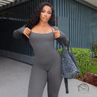 Woman in gray casual tight jumpsuit two piece set