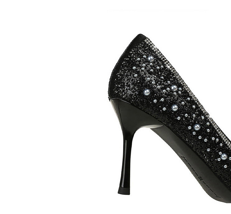 Langry black glitter stiletto pumps with pearl bowknot accents