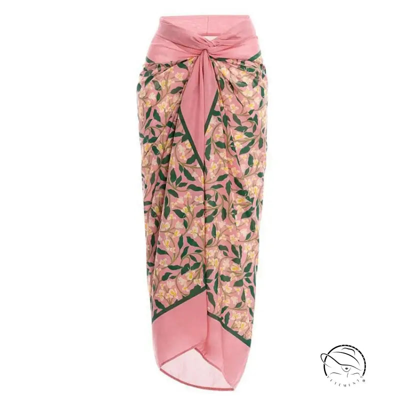 Pink floral sarong with tie waist and leaf pattern in cute bikini split swimsuit outfit