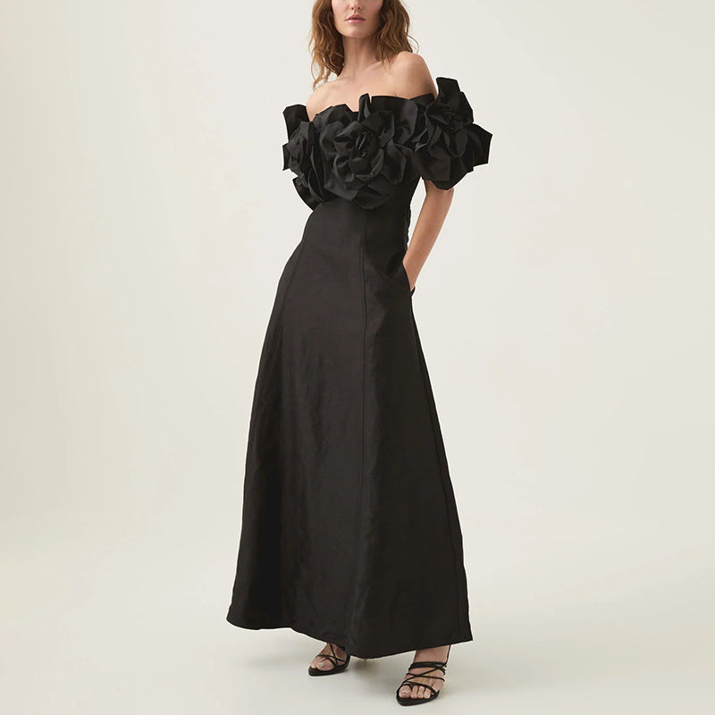 Black off-the-shoulder floral gown, perfect for elegant events, featured in a maxi dress collection