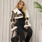 Langry fashion brown and white shearling cropped coat with faux leather stitching, black pants and boots