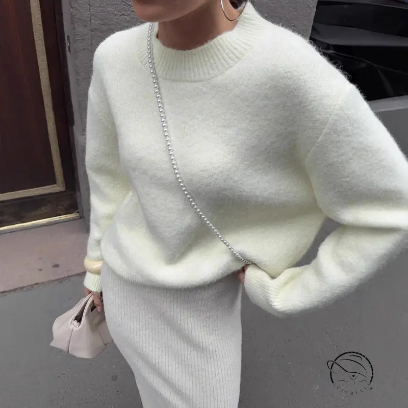 Winter loose long wool alpaca sweater with white fluffy design, ribbed hem, cuffs, pearl chain strap