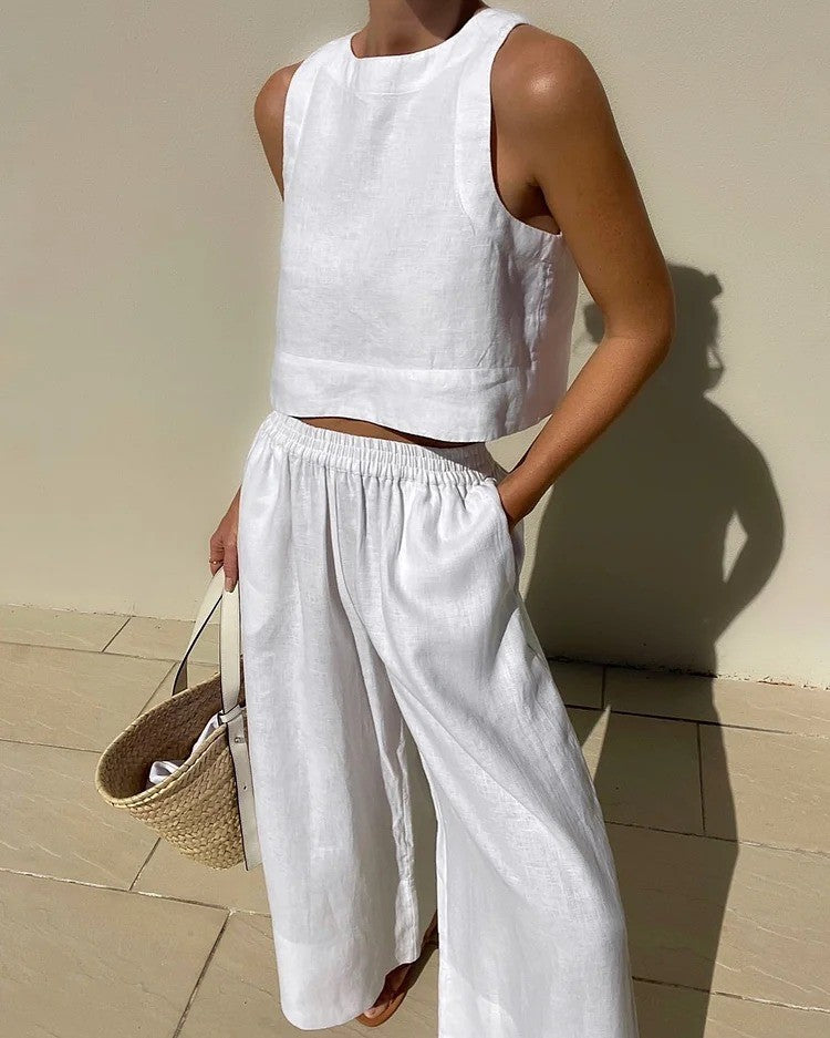 White linen two-piece outfit featuring a casual loose sleeveless shirt for stylish fashion