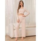 Woman wearing a ribbed knit crop top and pants set from Winter Casual Two Piece Pajamas