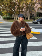 Gorgeous faux fur fox jacket with belt, jeans, tan bag by Langry fashion
