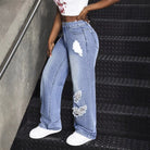 Ripped light-wash wide-leg jeans from Langry, perfect for versatile fashion ملابس