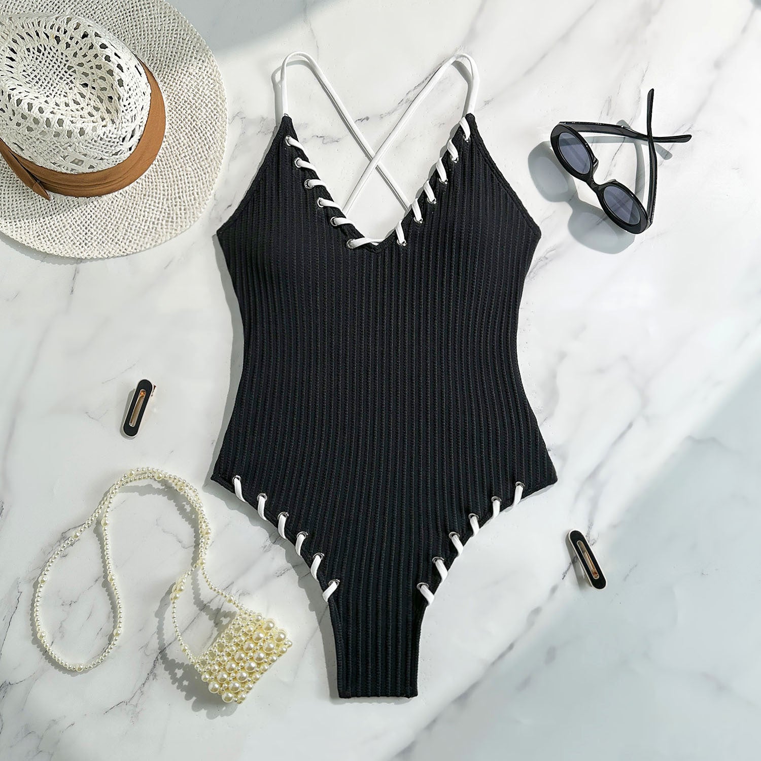 Black ribbed one-piece swimsuit with white stitching for stylish summer fashion ملابس