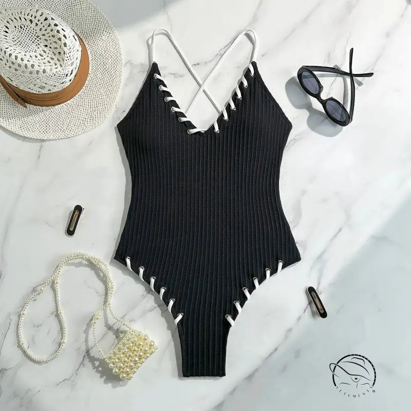 Stunning matching sling swimwear: black ribbed one-piece with white stitching