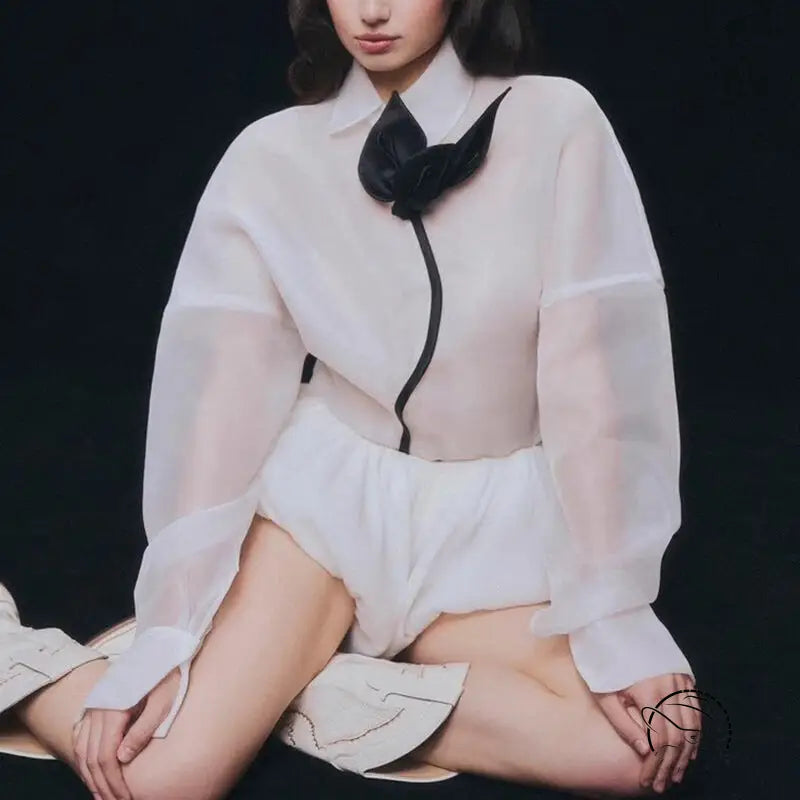 White sheer langry fashion blouse with black accents and bow tie