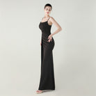 Elegant black satin slip dress with spaghetti straps and high slit