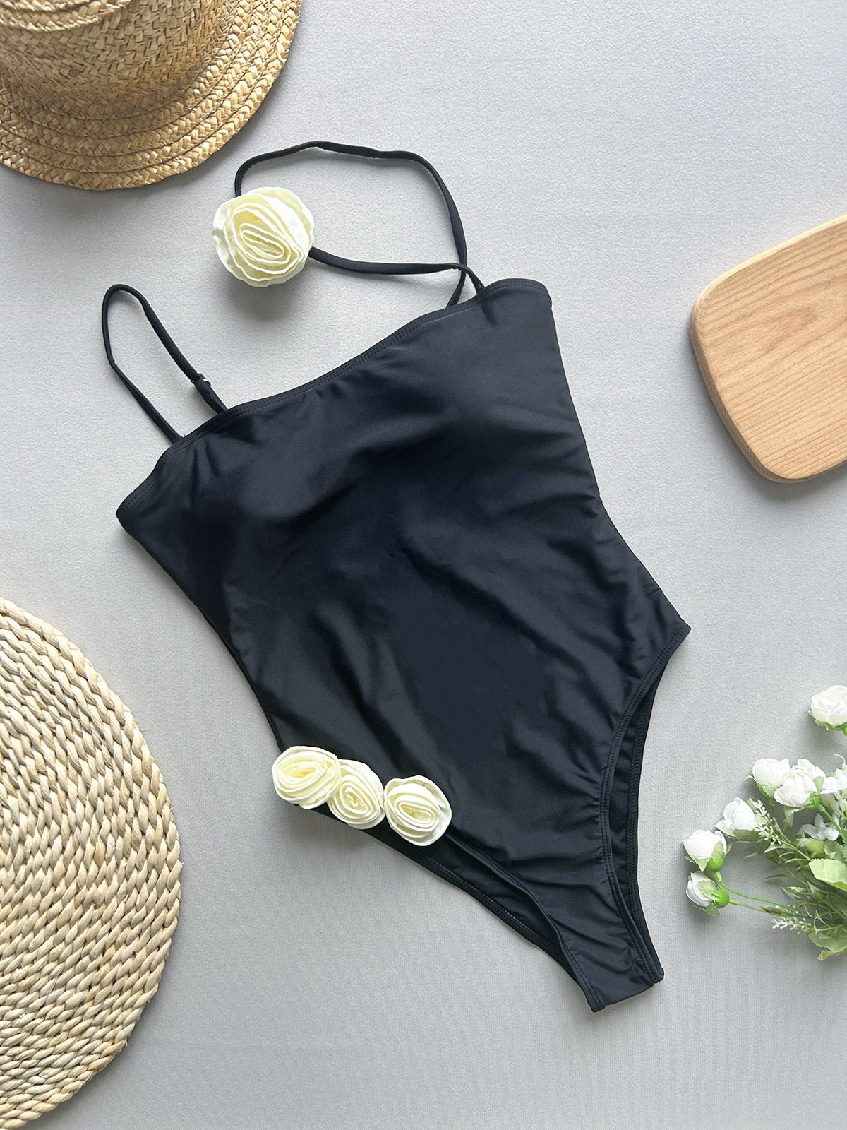 Black one-piece swimsuit with thin shoulder straps from Enchanting Beach Swimwear fashion