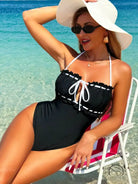 Black and white ruffled one-piece swimsuit with lace-up front by Langry