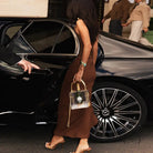 Elegant langry fashion dress with clear skull handbag chain and gold hardware