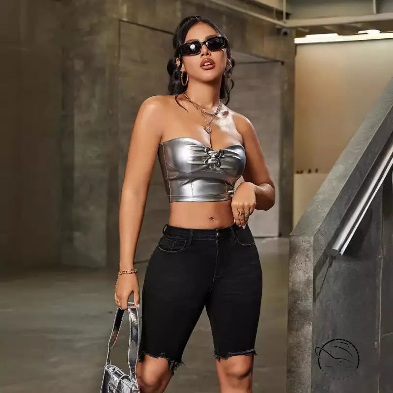 Silver strapless crop top with front tie, paired with denim shorts high waist