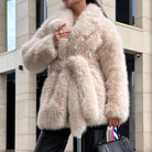 Beige fluffy faux fur coat with high collar and belt closure